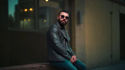 portrait photography,male model,portrait photographers,pompadour,portrait background,man portraits,man on a bench,bolero jacket,leather jacket,green jacket,men's wear,beatnik,turquoise leather,photographic background,alleyway,artist portrait,men clothes,digital compositing,beard,bearded