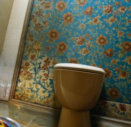 yellow wallpaper,bathroom accessory,bathroom,shower curtain,bathroom tissue,luxury bathroom,commode,chamber pot,bathtub accessory,toilet table,floral pattern,moroccan pattern,toilet,ceramic tile,damask paper,brown mold,spanish tile,washroom,plumbing fixture,wc