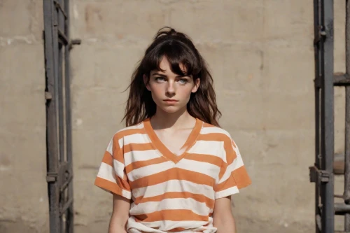feist,horizontal stripes,striped background,photo session in torn clothes,menswear for women,girl in t-shirt,isolated t-shirt,asymmetric cut,liberty cotton,girl in a long,video scene,young woman,female model,tiger lily,woman in menswear,portrait of a girl,stripes,the girl in nightie,orange,clementine,Photography,Natural