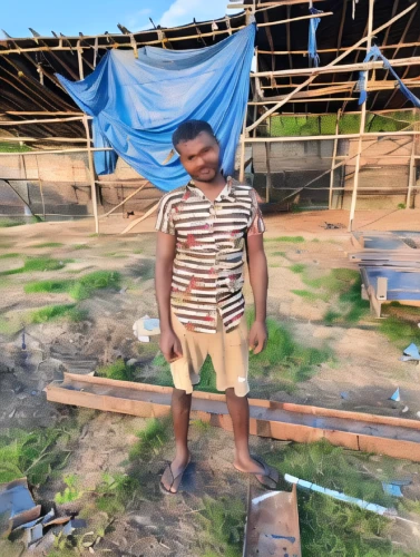 bangladeshi taka,anmatjere man,a carpenter,roof construction,roofing work,sweet potato farming,waste water system,straw roofing,stock farming,water well,wind powered water pump,bricklayer,basket weaver,fetching water,baghara baingan,dholak,silambam,brick-making,pakistani boy,devikund