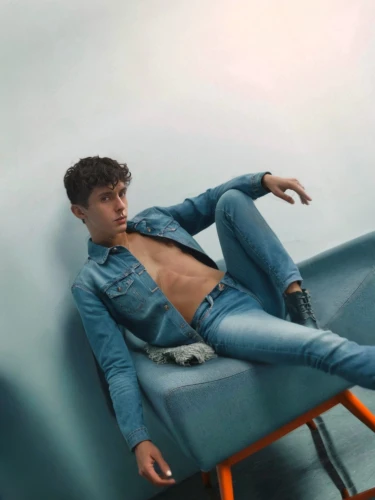lounger,male model,sunlounger,blue jeans,denim jeans,denim,jeans background,chaise,lounging,bluejeans,abdominals,baby blue,merman,cross legged,man on a bench,crossed legs,shirtless,turquoise leather,denims,sofa