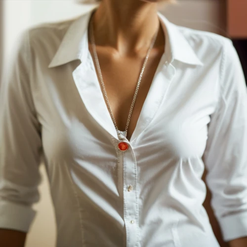 pearl necklace,pearl necklaces,white shirt,blouse,white-collar worker,dress shirt,necklace,collar,menswear for women,nurse uniform,in a shirt,red heart medallion,undershirt,white and red,pin-back button,white coat,pendant,women's clothing,women clothes,necklace with winged heart