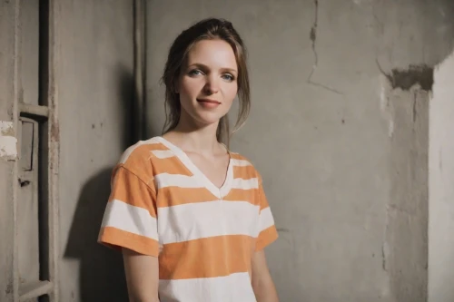 girl in t-shirt,photo session in torn clothes,striped background,isolated t-shirt,female model,women's clothing,horizontal stripes,orange,women clothes,polo shirt,girl in a long dress,orange color,long-sleeved t-shirt,video scene,liberty cotton,advertising clothes,cotton top,orange robes,torn dress,in a shirt,Photography,Natural