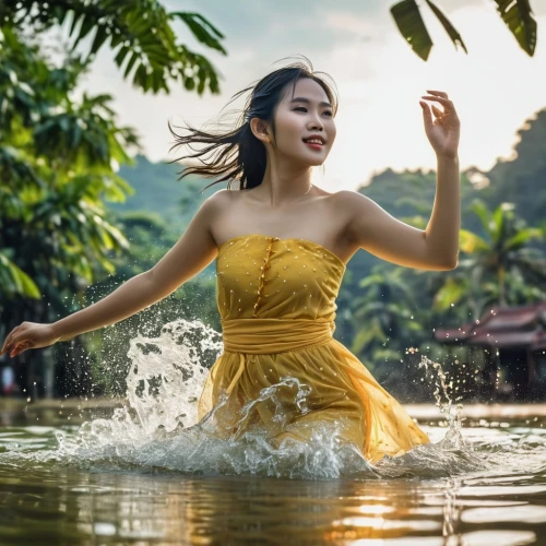 girl in a long dress,vietnamese woman,miss vietnam,girl on the river,yellow jumpsuit,water nymph,hula,water lotus,vietnam,photoshoot with water,ao dai,the blonde in the river,flowing water,water wild,throwing leaves,golden rain,vietnam vnd,sprint woman,splashing,yellow rose background,Photography,General,Realistic