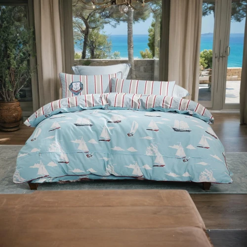 bed linen,duvet cover,bedding,blue pillow,slipcover,blue sea shell pattern,futon pad,bed sheet,quilt,duvet,mazarine blue,linens,soft furniture,sofa cushions,flamingo pattern,waterbed,sofa bed,sheets,sleeping pad,window valance