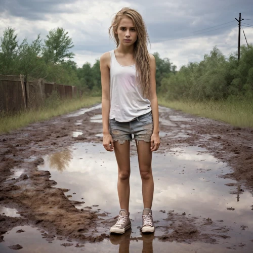 lily-rose melody depp,girl in t-shirt,countrygirl,blond girl,puddle,girl in overalls,farm girl,girl walking away,girl in a long,puddles,blonde girl,walking in the rain,mud,photo session in torn clothes,in the rain,isolated t-shirt,weather-beaten,linnet,girl sitting,rubber boots