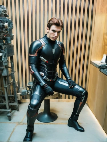 wetsuit,kneel,latex clothing,a wax dummy,latex,rubber doll,rubber,pvc,kneeling,dry suit,protective suit,the suit,x men,black leather,daredevil,harnessed,xmen,leather,black suit,protective clothing