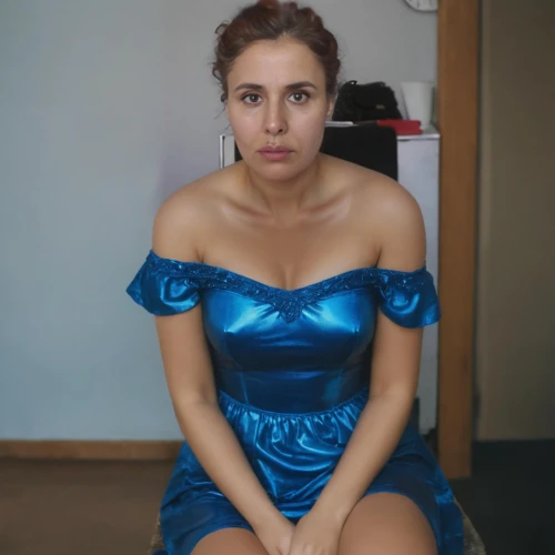 blue dress,a girl in a dress,bridesmaid,cinderella,woman sitting,dress,nice dress,torn dress,ojos azules,depressed woman,sitting on a chair,blue,social,short dress,party dress,girl sitting,day dress,strapless dress,girl in a long dress,sitting