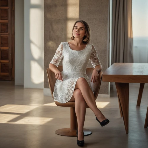 white winter dress,plus-size model,menswear for women,female model,sitting on a chair,woman sitting,elegant,elegance,beautiful legs,white skirt,white dress,business woman,woman's legs,women's clothing,sheath dress,women fashion,secretary,women clothes,cocktail dress,white clothing,Photography,General,Natural