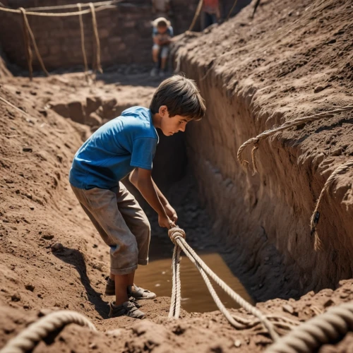 excavation work,archaeological dig,excavation,excavation site,roman excavation,brick-making,clay soil,digging equipment,brick-laying,child playing,mud village,bricklayer,digging,gold mining,children playing,brick-kiln,sandbox,dig a hole,construction of the wall,building sand castles