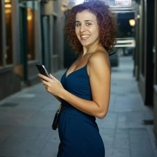 woman holding a smartphone,female model,photo session at night,social media addiction,music on your smartphone,women in technology,woman holding gun,a girl with a camera,mobile banking,sprint woman,pregnant woman,portrait photographers,text messaging,mobile device,woman walking,text message,sheath dress,attractive woman,digital advertising,voice search