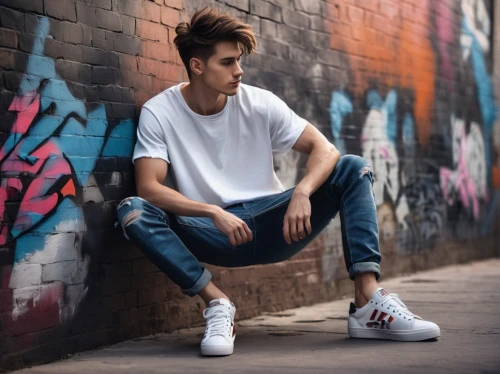 ripped jeans,boy model,jeans background,quiff,skater,converse,skinny jeans,brick wall background,concrete background,young model,red brick wall,boys fashion,man on a bench,white clothing,alleyway,sneakers,skater boy,male model,shoes icon,white shirt,Conceptual Art,Fantasy,Fantasy 17