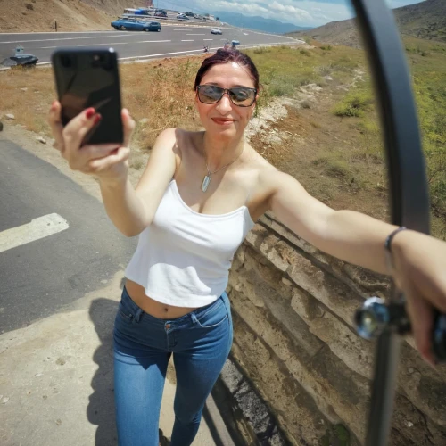 gopro,selfie stick,gopro session,go pro,rear-view mirror,monopod,a girl with a camera,mobile camera,car mirror,taking picture,taking photo,camera,side mirror,viewfinder,dji spark,bixby bridge,taking photos,cameras,gaztelugatxe,camera accessory