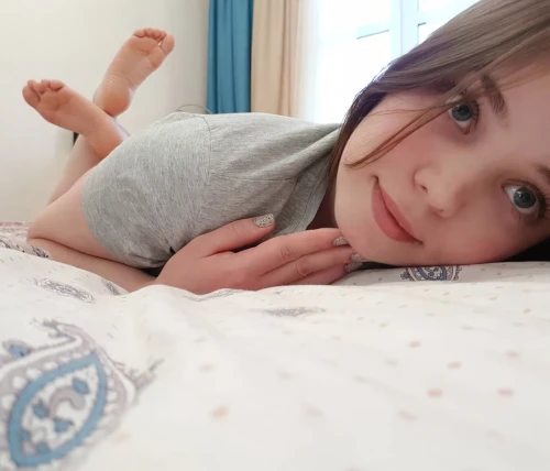 lying down,laying down,girl in bed,lazing around,bed,feet with socks,laying,pjs,pajamas,tummy time,feet,heterochromia,on the couch,lounging,long socks,feet closeup,looking through legs,cute,bed skirt,kawaii girl