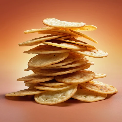 dried lemon slices,potato crisps,potato chips,papadum,pizza chips,sliced tangerine fruits,pringles,sopaipilla,potato chip,tortilla chip,tortillas,crispbread,parmesan wafers,stack of cookies,crisp bread,biscuit crackers,palmier,chips,corn tortilla,stack of plates,Photography,General,Realistic