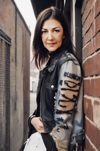 leather jacket,brick wall background,denim background,brick background,leather,portrait background,female warrior,concrete background,portrait photography,social,nikita,women fashion,mulan,warrior woman,leather boots,jeans background,joan of arc,biker,photographic background,woman in menswear,Photography,Natural