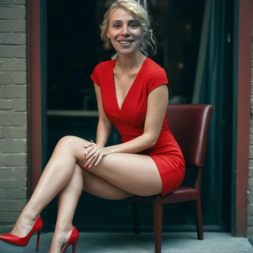 girl in red dress,red dress,in red dress,man in red dress,lady in red,on a red background,sitting on a chair,short dress,red bench,beautiful legs,legs crossed,red,red background,red skirt,looking through legs,crossed legs,red shoes,cocktail dress,bright red,nice dress