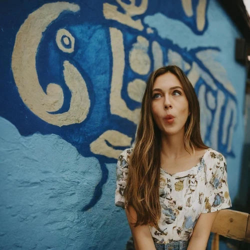 painted wall,a girl with a camera,georgia,graffiti,jena,wooden wall,sofia,tongue,lubitel 2,girl with speech bubble,girl in a long dress,ukrainian,blue doors,zenit,nostril,feist,painted block wall,orla,film roll,samara