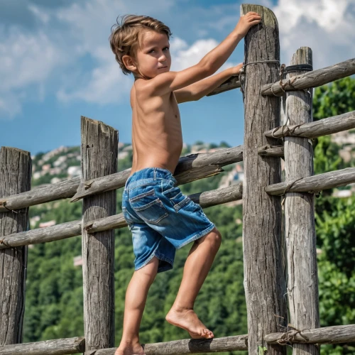 rock climber,adventure playground,climbing wall,rope bridge,child playing,mountain climber,climbing slippery pole,tarzan,huggies pull-ups,rope ladder,photographing children,outdoor play equipment,basque rural sports,playground slide,wooden fence,rope jumping,child in park,rope-ladder,rope climbing,obstacle race,Photography,General,Realistic