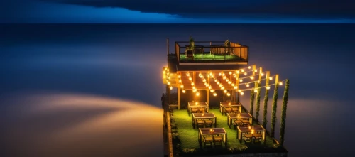 lifeguard tower,fishing pier,illuminated lantern,diving bell,floating restaurant,electric lighthouse,wooden pier,beach restaurant,jetty,light house,long exposure,bench by the sea,old pier,stilt house,ferryboat,teak bridge,container vessel,stairway to heaven,sea night,lantern,Photography,General,Realistic
