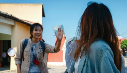 woman holding a smartphone,handshaking,girl with speech bubble,woman pointing,korean drama,baguazhang,greeting,pointing woman,hand shake,the girl's face,transaction,asian semi-longhair,girl holding a sign,waving hello,handshake,door mirror,palm reading,high five,the gesture of the middle finger,hands holding plate,Photography,General,Realistic