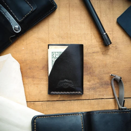 wallet,leather goods,pocket flap,e-book reader case,woman holding a smartphone,e-wallet,mobile phone case,product photos,leather compartments,leather suitcase,pocket lighter,gps case,jeans pocket,passport,coin purse,luxury accessories,lenovo 1tb portable hard drive,ledger,leather texture,phone case