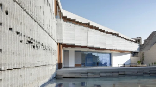 water wall,glass facade,archidaily,soumaya museum,aqua studio,exposed concrete,getty centre,ica - peru,dunes house,dhabi,athens art school,water cube,glass blocks,facade panels,chancellery,jewelry（architecture）,glass facades,cubic house,glass wall,swimming pool,Photography,General,Realistic