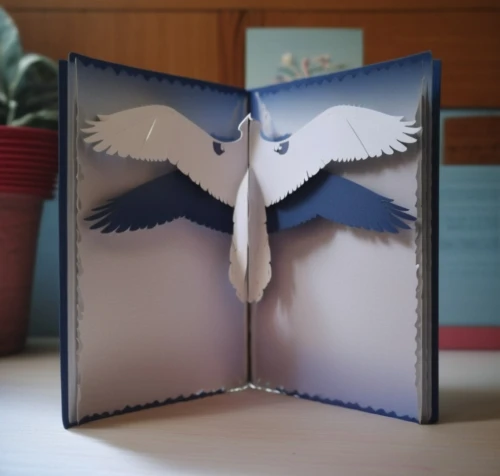 index card box,paper art,card box,facial tissue holder,page dividers,napkin holder,place card holder,e-book reader case,paper stand,book pages,paper frame,gift box,stack book binder,folded paper,facial tissue,boobook owl,clip board,book gift,origami,giftbox,Photography,General,Realistic