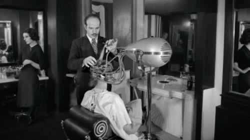 mirror ball,barbershop,barber shop,hairdresser,movie camera,sousaphone,orrery,hairdressing,barber chair,hairstylist,barber,spy visual,eight-ball,bellboy,revolving door,magic mirror,parabolic mirror,the ball,golden record,the long-hair cutter