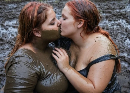 mud wrestling,girl kiss,redheads,wet,mud,maori,making out,love in the mist,aboriginal culture,kissing,water hole,in the rain,two girls,kissing frog,cheek kissing,thermal spring,mother kiss,clay mask,hot love,bodypainting