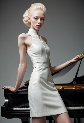 pianist,piano player,concerto for piano,steinway,piano keyboard,tilda,piano,play piano,jazz pianist,clavichord,white lady,female model,grand piano,player piano,pianet,piano lesson,marylyn monroe - female,bridal clothing,pearl,white winter dress