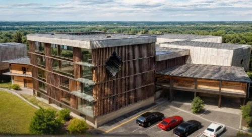 ski facility,eco hotel,metal cladding,drone image,houston texas apartment complex,new building,solar cell base,industrial building,north american fraternity and sorority housing,eco-construction,multi-story structure,kettunen center,arkansas,olympia ski stadium,valley mills,new housing development,commercial hvac,apartment complex,golf hotel,wooden facade
