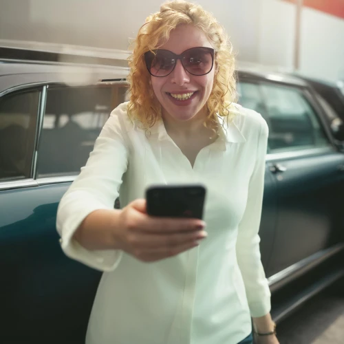 woman holding a smartphone,woman in the car,auto financing,zagreb auto show 2018,auto show zagreb 2018,girl and car,mobile banking,net promoter score,customer success,car sales,blonde woman reading a newspaper,girl in car,women in technology,bussiness woman,car rental,car dealer,mobile phone car mount,retro woman,the style of the 80-ies,customer experience