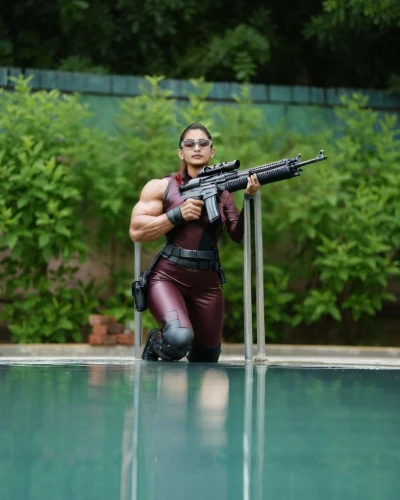 hard woman,female swimmer,muscle woman,pool cleaning,cosplay image,girl with a gun,girl with gun,woman holding gun,action hero,cosplayer,super heroine,female warrior,actionfigure,action figure,greta oto,cyberpunk,harley quinn,dug-out pool,ronda,mercenary