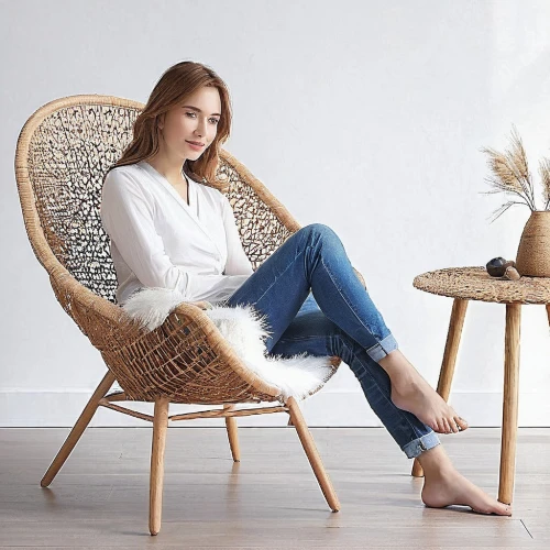 sitting on a chair,crossed legs,rocking chair,legs crossed,woman sitting,blonde on the chair,danish furniture,wicker,seated,chair,in seated position,scandinavian style,hanging chair,sitting,basket wicker,girl sitting,cross-legged,bench chair,armchair,seating furniture,Photography,Documentary Photography,Documentary Photography 10
