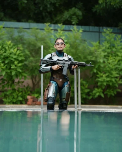aquanaut,divemaster,female swimmer,dry suit,diver,wetsuit,vax figure,dive computer,scuba,aqua studio,swimming machine,pool cleaning,swimming technique,freediving,scuba diving,buoyancy compensator,actionfigure,human torpedo,infinity swimming pool,jumping into the pool