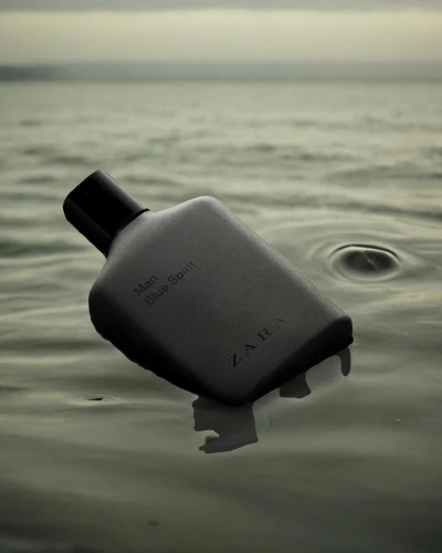 message in a bottle,wet smartphone,isolated bottle,flask,dinghy,buoyancy compensator,submersible,cologne water,safety buoy,bottle surface,drift bottle,water jug,personal water craft,bottlenose,buoy,htc one m8,black water,water connection,the vessel,bay water