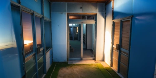 capsule hotel,hallway space,blue doors,prefabricated buildings,accommodation,hallway,dormitory,shared apartment,blue room,an apartment,sliding door,sky apartment,inverted cottage,corridor,door-container,hostel,appartment building,home door,blue door,japanese-style room,Photography,General,Realistic