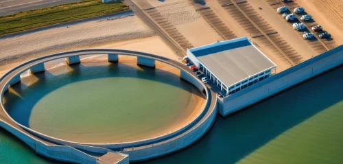 wastewater treatment,sewage treatment plant,hydropower plant,hydroelectricity,danube lock,wastewater,cooling tower,water power,water plant,inland port,danube bridge,aerial landscape,overhead shot,aerial photography,sluice gate,storage tank,salt evaporation pond,aerial lift bridge,bird's eye view,concrete plant,Photography,General,Realistic