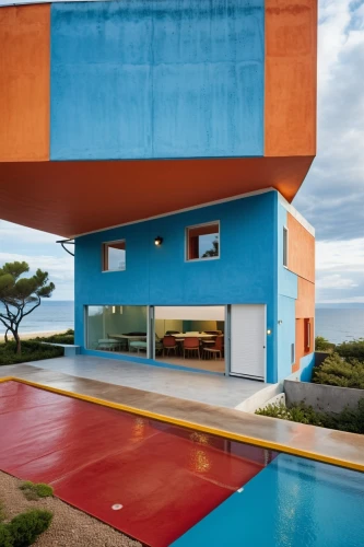 dunes house,cubic house,cube house,beach house,holiday home,mid century house,mid century modern,house of the sea,corten steel,colorful facade,pool house,teal and orange,modern architecture,aqua studio,cube stilt houses,aperol,holiday villa,modern house,chile house,gulf,Photography,General,Realistic