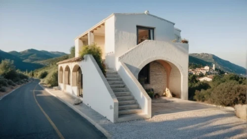 dunes house,cubic house,karpathos,house in the mountains,house in mountains,stone house,tiled roof,holiday villa,roof landscape,architectural style,iranian architecture,private house,stucco wall,amorgos,frame house,house shape,clay house,folding roof,residential house,stucco frame