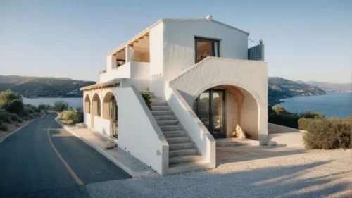 dunes house,cubic house,santorini,private house,holiday villa,stucco frame,inverted cottage,stone house,exterior decoration,architectural style,beautiful home,house by the water,house shape,luxury property,stucco wall,house for rent,holiday home,frame house,residential house,modern architecture