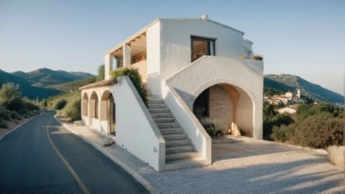 dunes house,cubic house,house in mountains,house in the mountains,stone house,holiday villa,architectural style,karpathos,roof landscape,stucco wall,tiled roof,private house,house shape,folding roof,iranian architecture,frame house,residential house,stucco frame,clay house,exterior decoration