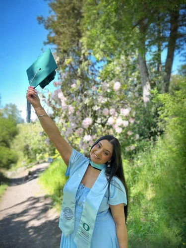 hpnotiq,graduate,graduate hat,graduating,graduation cap,graduation day,graduation,to flourish,throwing leaves,with a bouquet of flowers,college graduation,ecstatic,blue green,blue and green,baby blue,graduated cylinder,green and blue,flourish,girl in flowers,blue balloons