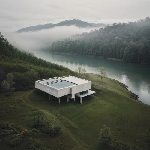 house with lake,lago grey,hydropower plant,boathouse,house in the mountains,archidaily,house in mountains,house by the water,pool house,boat house,modern house,swiss house,dunes house,inverted cottage,modern architecture,mirror house,hydroelectricity,summer house,private house,tennessee