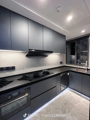 dark cabinets,modern kitchen interior,modern kitchen,dark cabinetry,modern minimalist kitchen,kitchen design,kitchen interior,new kitchen,polished granite,under-cabinet lighting,kitchen cabinet,kitchen stove,big kitchen,chefs kitchen,granite counter tops,tile kitchen,galley,exhaust hood,kitchen remodel,cabinetry