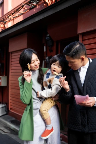 parents with children,photographing children,japanese culture,harmonious family,consumer protection,family care,parents and children,namsan hanok village,family taking photos together,international family day,woman holding a smartphone,family outing,blogs of moms,father with child,korean culture,happy family,prospects for the future,alipay,mobile banking,the integration of social