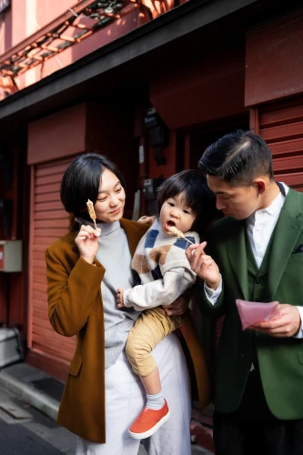 parents with children,photographing children,alipay,woman holding a smartphone,family taking photos together,mobile banking,mobile phone car mount,parents and children,mobile payment,tokyo disneysea,father with child,digital data carriers,china cny,consumer protection,happy family,dji spark,the integration of social,street photography,prospects for the future,harmonious family