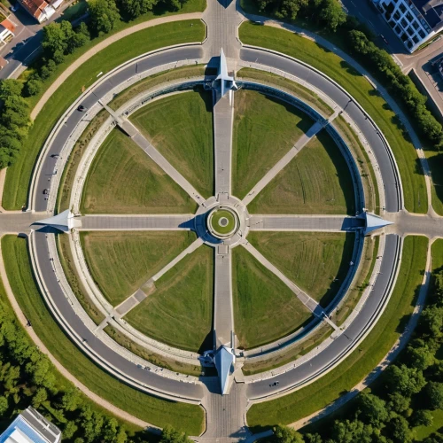 highway roundabout,traffic circle,roundabout,the center of symmetry,semi circle arch,olympiapark,oval forum,mavic 2,ellipse,capitol square,flyover,bird's-eye view,bird's eye view,symmetrical,stalin skyscraper,helipad,three centered arch,360 °,aerial,champ de mars