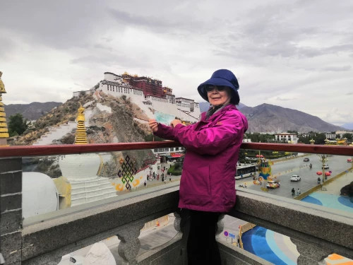 potala palace,potala,lhasa,tibet,prayer wheels,cultural tourism,tourist attraction,great wall of china,72 turns on nujiang river,tigers nest,white temple,construction of the wall,tibetan,danyang eight scenic,woman holding a smartphone,hall of supreme harmony,forbidden palace,yunnan,great wall,sightseeing